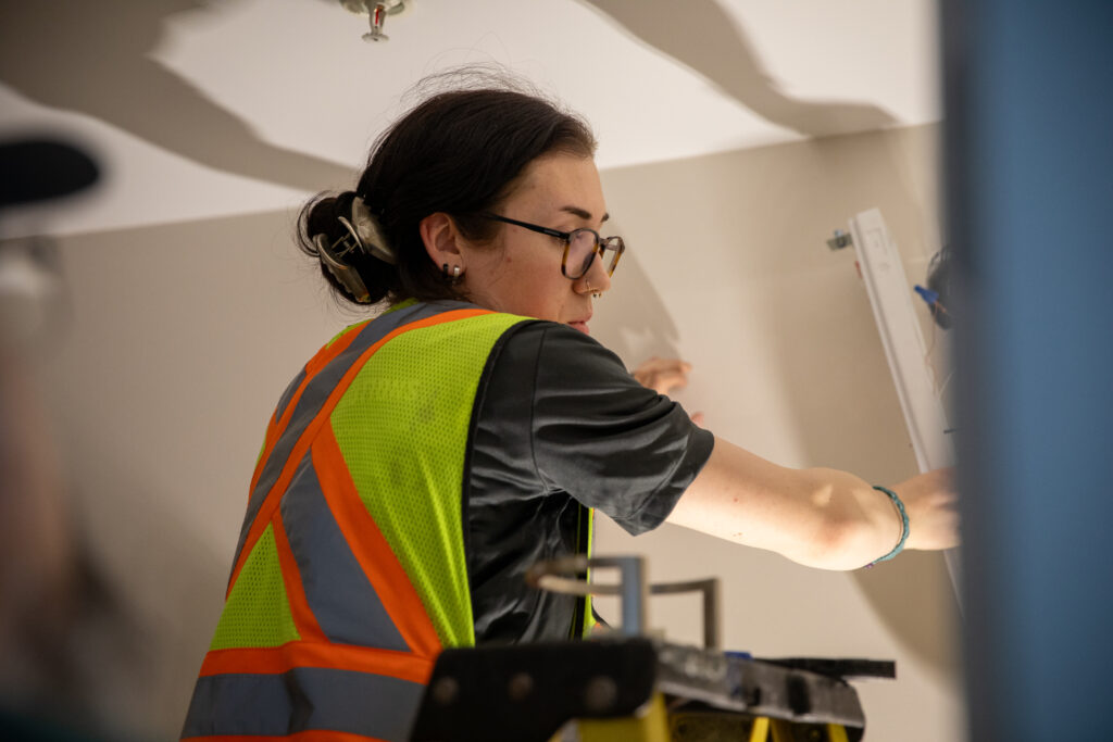 esl group female electrician esl group female electrician on ladder