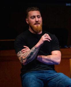 spencer speaking at a meeting